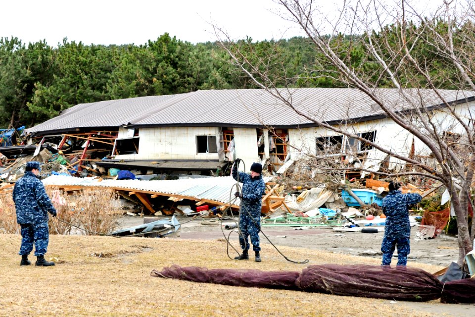 Defense.gov News Photo 110315-N-MU720-010 - U.S. Navy sailors remove debris from a park at the fishing port in Misawa Japan on March 15 2011. More than 120 sailors and airmen from Naval