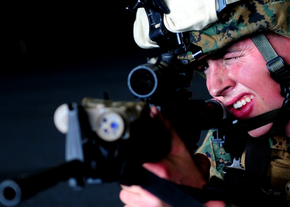 Defense.gov News Photo 110203-N-5538K-154 - Lance Cpl. Doug Hale assigned to the 31st Marine Expeditionary Unit participates in small-arms weapons training in the hangar bay of the