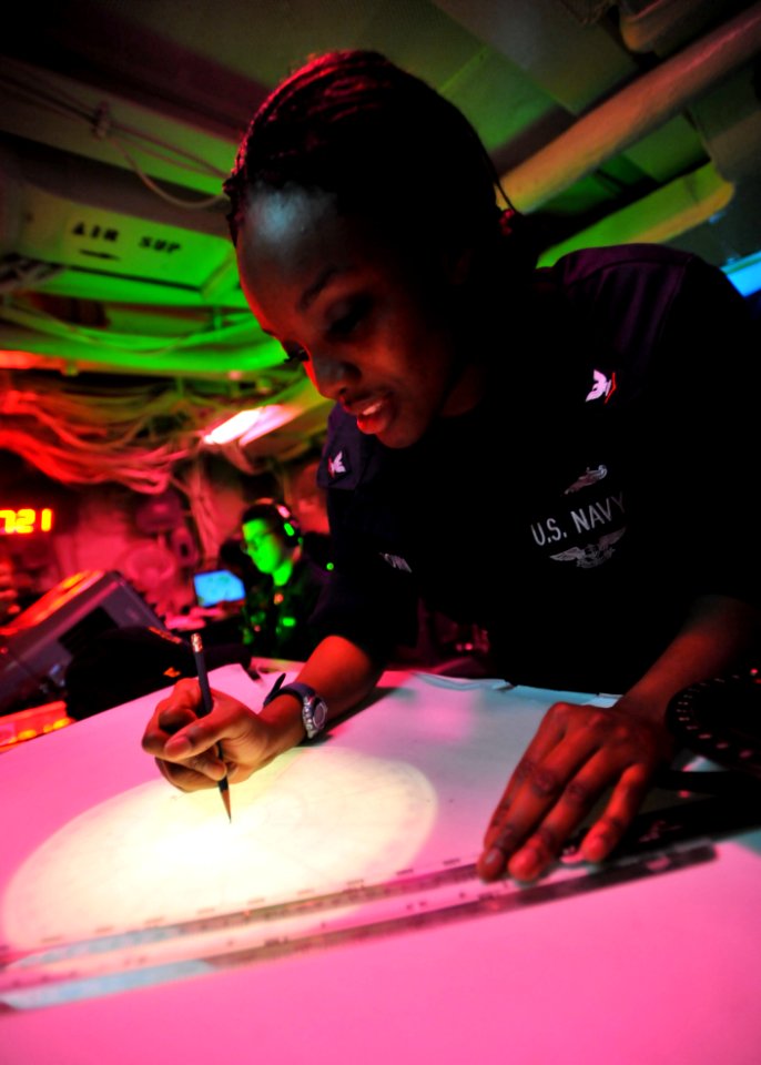 Defense.gov News Photo 110308-N-0569K-048 - Petty Officer 3rd Class Lakysha Brown uses the dead reckoning tracer to plot the ship s course and speed in the commanding officer s tactical plot