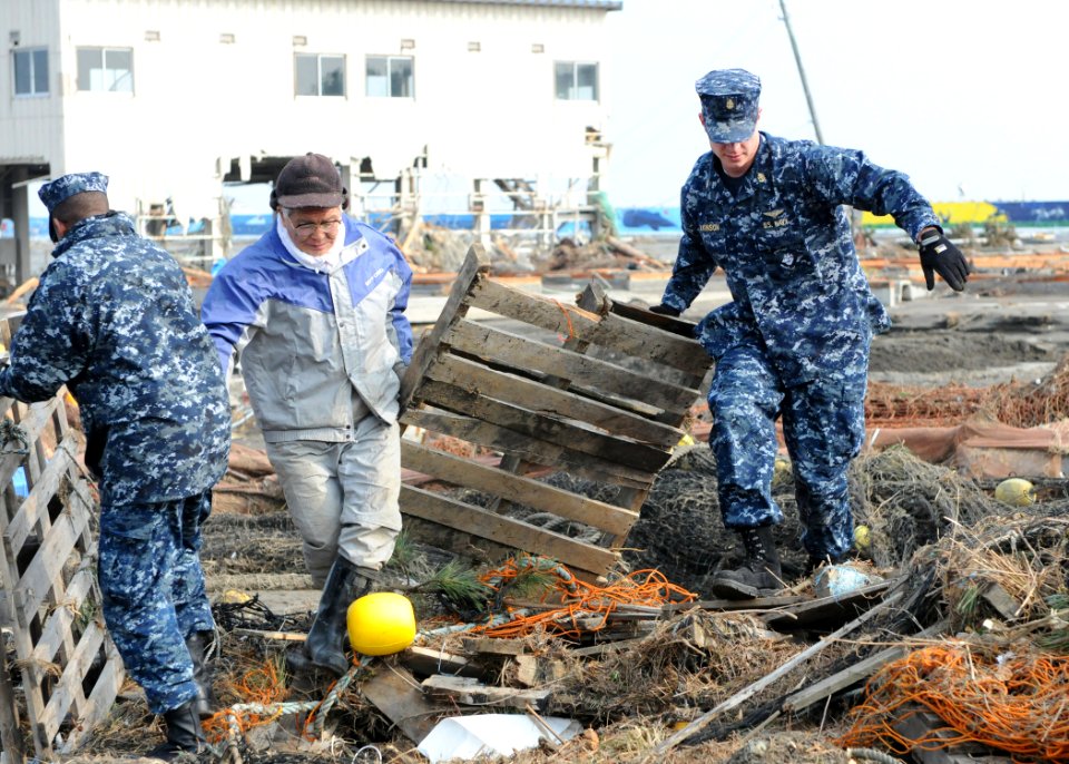 Defense.gov News Photo 110314-N-MU720-059 - Chief Petty Officer Kyle Wilkinson right from Baldwinsville N.Y. assigned to Naval Air Facility Misawa helps remove debris during a cleanup