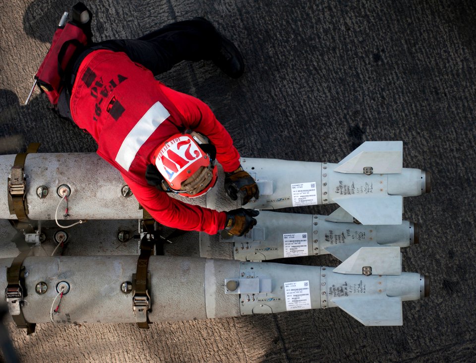 Defense.gov News Photo 110220-N-DR144-159 - Airman Hector Nevarez assigned to Strike Fighter Squadron 81 moves ordnance on the flight deck of the aircraft carrier USS Carl Vinson CVN 70 in