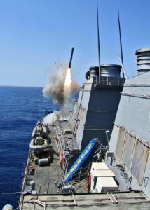 Defense.gov News Photo 110329-N-3396H-001 - The guided-missile destroyer USS Barry DDG 52 launches a Tomahawk cruise missile to support Joint Task Force Odyssey Dawn in the Mediterranean Sea