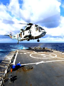 Defense.gov News Photo 110405-N-XX151-013 - U.S. Navy flight crew members aboard the guided missile destroyer USS Stethem DDG 63 prepare to tie down an Indian navy MK42 Sea Hawk helicopter as