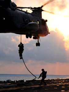 Defense.gov News Photo 110324-N-ZS026-196 - U.S. Marines assigned to the 13th Marine Expeditionary Unit drop from a CH-46 Sea Knight helicopter assigned to Marine Medium Squadron 163 to the