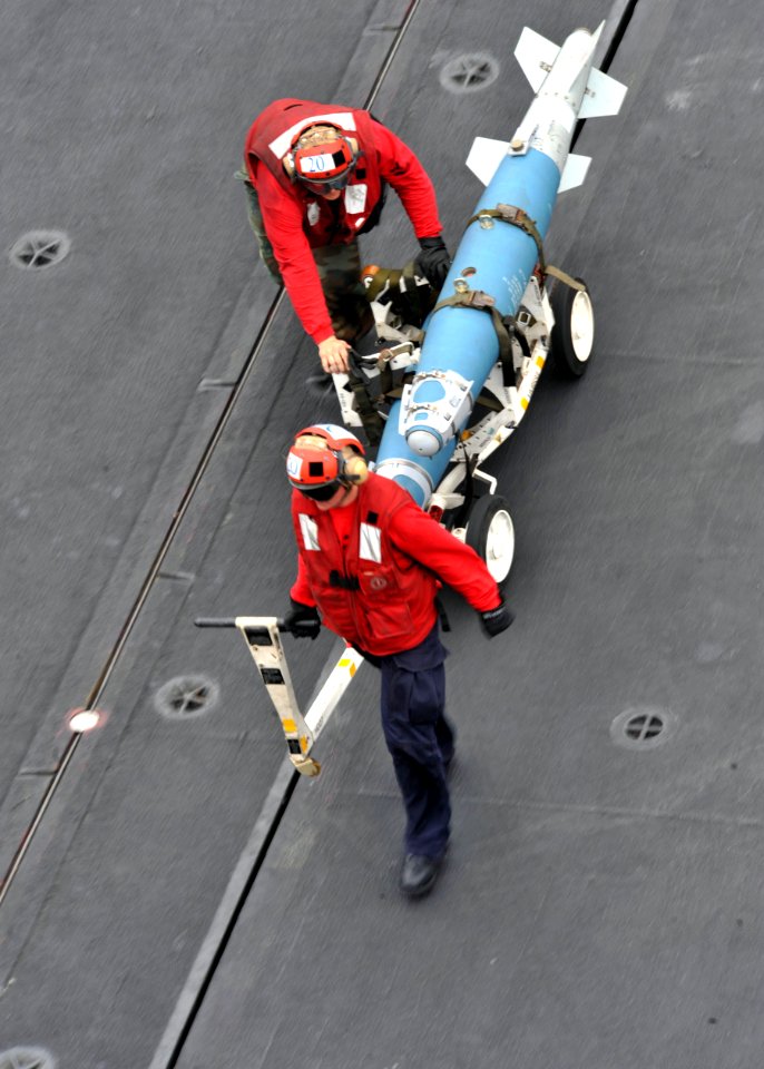 Defense.gov News Photo 110307-N-0569K-042 - Sailors move ordnance on the flight deck of the aircraft carrier USS Enterprise CVN 65 during flight operations while underway in the Red Sea on