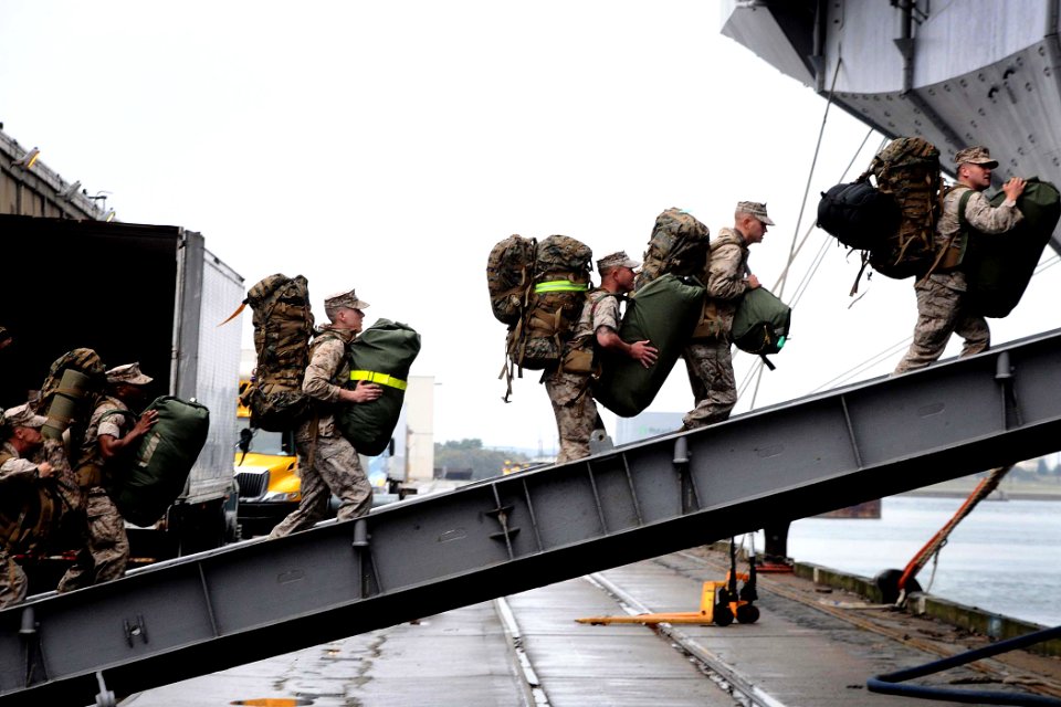 Defense.gov News Photo 110328-N-7508R-142 - U.S. Marines embark aboard the multipurpose amphibious assault ship USS Bataan in Morehead City N.C. on March 28 2011. The Bataan Amphibious