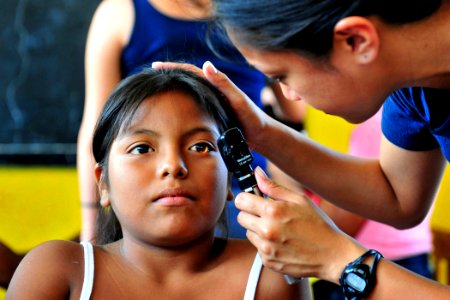 Defense.gov News Photo 110503-N-QD416-154 - U.S. Navy Lt. Patricia Salazar examines a patient s eyes at a Continuing Promise medical clinic set up by staff assigned to the hospital ship USNS