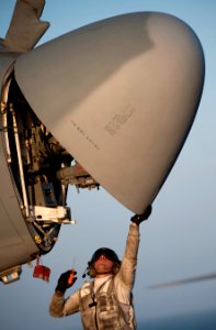 Defense.gov News Photo 110326-N-DR144-077 - Petty Officer 3rd Class Andre Estrada assigned to Electronic Attack Squadron 134 inspects the radar of an EA-6B Prowler aboard the flight deck of
