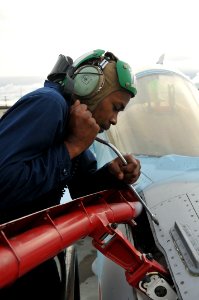 Defense.gov News Photo 110614-N-GO535-970 - U.S. Navy Petty Officer 3rd Class Yusuf Martin assigned to Fighter Squadron Composite 12 completes maintenance on the in-flight refueling probe