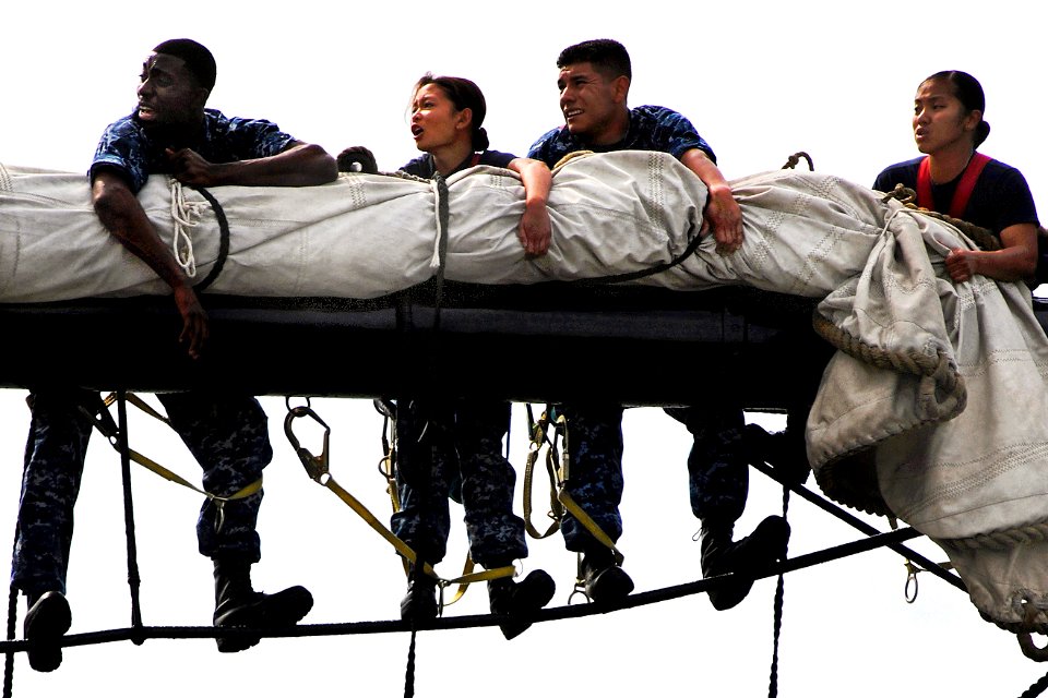 Defense.gov News Photo 110629-N-SH953-348 - U.S. Navy sailors place the sail on the yard of the main mast aboard the USS Constitution for the first time since the ship began a restoration
