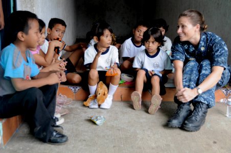 Defense.gov News Photo 110708-N-VV618-286 - U.S. Navy Lt. Audrey Koecher right the judge staff advocate for Continuing Promise 2011 talks with children during a community relations event