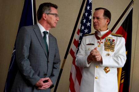 Defense.gov News Photo 110609-N-TT977-358 - Chairman of the Joint Chiefs of Staff Adm. Mike Mullen thanks German Minister of Defense Thomas de Maizière after receiving the German Order of Merit