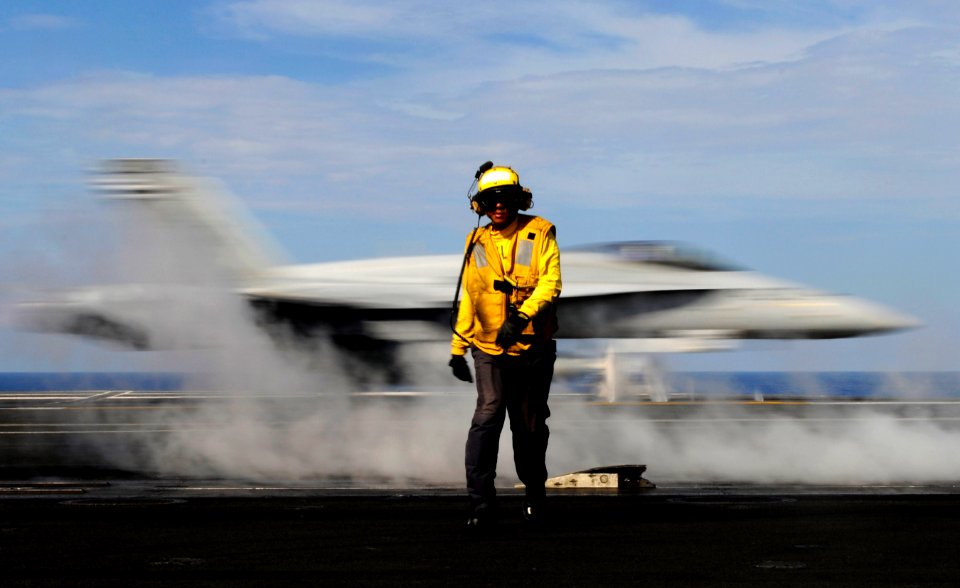 Defense.gov News Photo 110513-N-GZ277-144 - Petty Officer 2nd Class Jason Querido assigned to the air department of the aircraft carrier USS Carl Vinson CVN 70 works as an aircraft