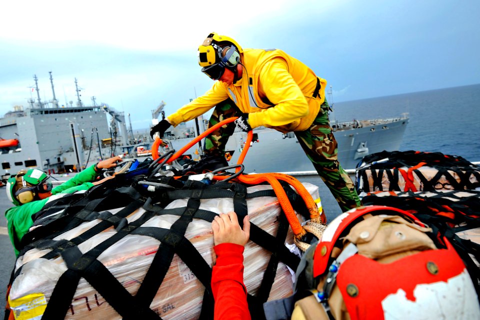 Defense.gov News Photo 110726-N-NY820-190 - U.S. Navy flight deck personnel assigned to the USNS Comfort unpack cargo during a replenishment mission in the Pacific Ocean on July 26 2011. The