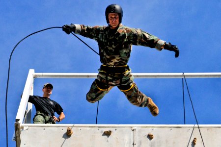 Defense.gov News Photo 110720-N-WW409-534 - U.S. Navy Lt. Ryan Ramsden rappels off a tower while training with members of the Australian Northern Territory Tactical Response Group during