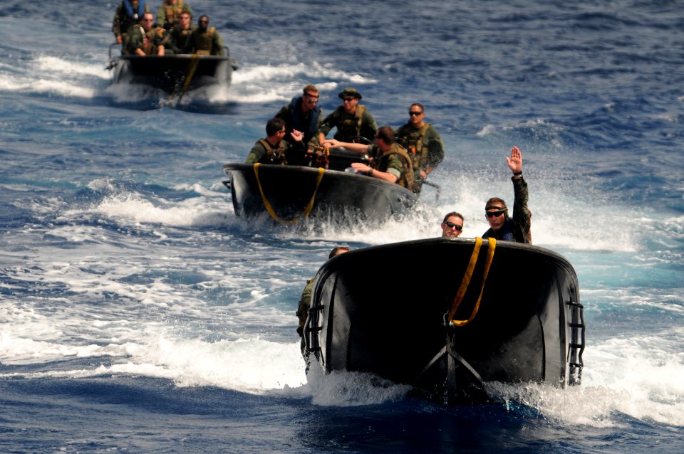 Defense.gov News Photo 110628-N-YO394-195 - A Dutch Marine right with the Royal Netherlands Marine Corps directs U.S. sailors with Riverine Squadron 3 during a come along side maneuver
