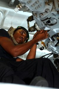 Defense.gov News Photo 110727-N-TU894-092 - U.S. Navy Petty Officer 3rd Class Gavin Persaud cleans and inspects the rotor assembly of an MH-60S Seahawk helicopter assigned to Helicopter Sea photo