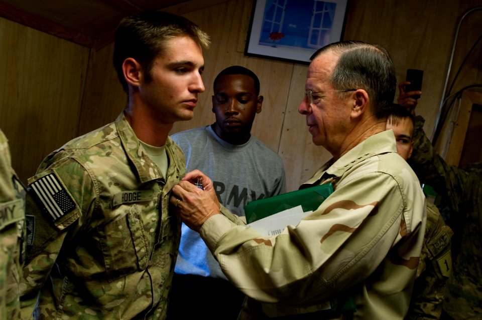 Defense.gov News Photo 110801-N-TT977-122 - Chairman of the Joint Chiefs of Staff Adm. Mike Mullen presents the Purple Heart to U.S. Army Spc. Preston M. Hodge at Bagram Air Base