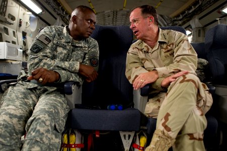 Defense.gov News Photo 110801-N-TT977-414 - Chairman of the Joint Chiefs of Staff Adm. Mike Mullen speaks with Commander of U.S. Forces-Iraq Gen. Lloyd Austin U.S. Army onboard a C-17