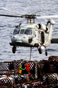 Defense.gov News Photo 110714-N-IC111-108 - U.S. Navy sailors assigned to the fast combat support ship USNS Bridge T-AOE 10 attach pallets of cargo to an MH-60S Seahawk helicopter assigned