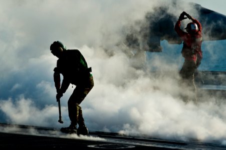 Defense.gov News Photo 111128-N-BT887-106 - A U.S. Navy sailor retrieves a hold back bar during flight operations aboard the aircraft carrier USS John C. Stennis CVN 74 in the Arabian Gulf on