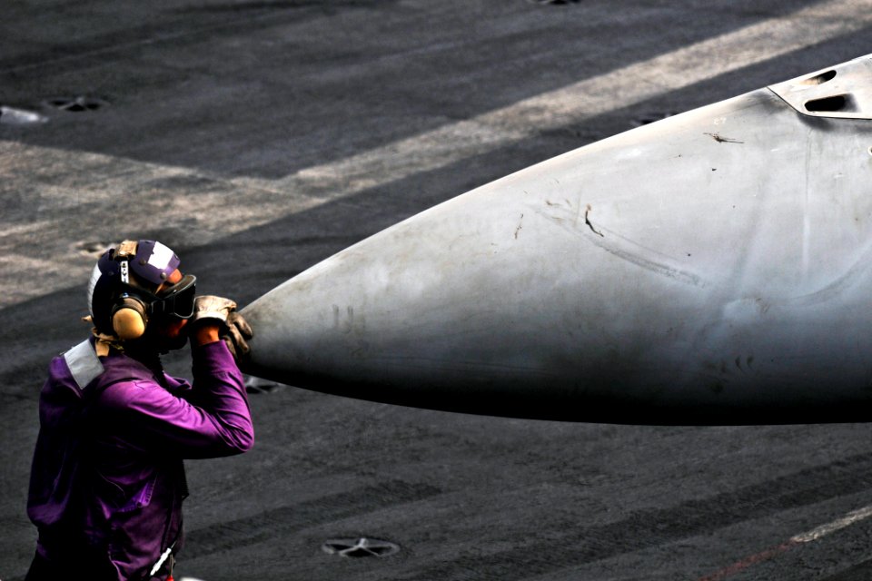 Defense.gov News Photo 110719-N-XE109-147 - U.S. Navy Petty Officer 3rd Class Bryan Herring takes a moment to relax on the flight deck aboard the aircraft carrier USS George H.W. Bush in the