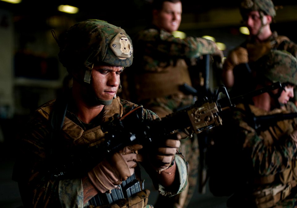 Defense.gov News Photo 111202-N-DX615-029 - U.S. Marine Corps Sgt. Alex Sanchez assigned to the 11th Marine Expeditionary Unit uses an M4 carbine to practice weapon malfunction drills in