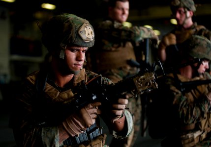 Defense.gov News Photo 111202-N-DX615-029 - U.S. Marine Corps Sgt. Alex Sanchez assigned to the 11th Marine Expeditionary Unit uses an M4 carbine to practice weapon malfunction drills in