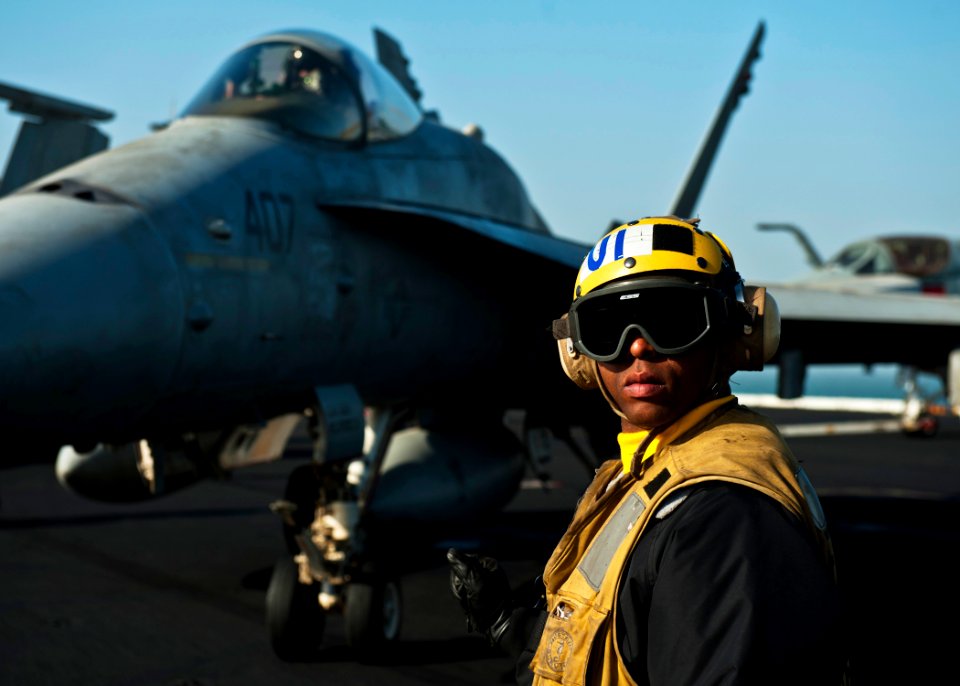 Defense.gov News Photo 111212-N-BT887-136 - U.S. Navy Petty Officer 1st Class Brian Adams checks for a clear deck aboard the aircraft carrier USS John C. Stennis CVN 74 in the Persian Gulf on