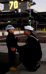 Defense.gov News Photo 111130-N-GZ277-115 - U.S. Navy Petty Officer 3rd Class Teejay Sunglao says goodbye to his son before the aircraft carrier USS Carl Vinson CVN 70 departs Naval Air