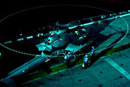 Defense.gov News Photo 111230-N-DX615-140 - U.S. Navy sailors conduct the hot refueling of an AH-1 Cobra attack helicopter during night flight operations aboard the USS Makin Island in the