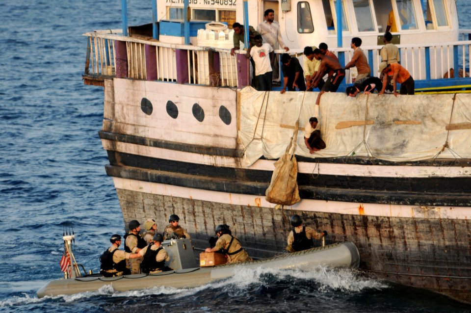 Defense.gov News Photo 110813-N-XQ375-361 7853 - Crewmembers aboard the Al Habib a Sri Lankan-flagged cargo vessel hoist a bag of supplies from a visit board search and seizure team in a rigid