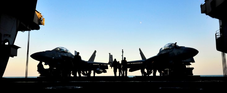 Defense.gov News Photo 111206-N-EZ913-076 - U.S. Navy sailors move fixed wing aircraft aboard the aircraft carrier USS John C. Stennis CVN 74 in the Persian Gulf on Dec. 6 2011. The John C