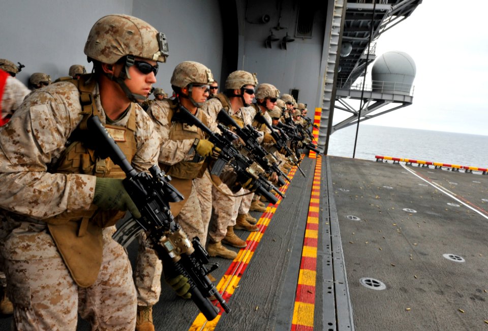 Defense.gov News Photo 110910-N-KS651-945 - U.S. Marines assigned to the 11th Marine Expeditionary Unit stand at the ready during a live-fire exercise aboard the amphibious assault ship USS