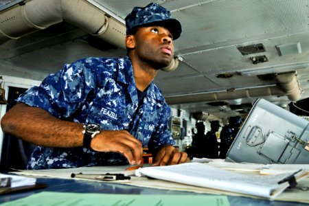Defense.gov News Photo 120115-N-JN612-022 - U.S. Navy Seaman Roosevelt Feazell charts a course from the bridge of the aircraft carrier USS Abraham Lincoln in the U.S. 7th Fleet area of