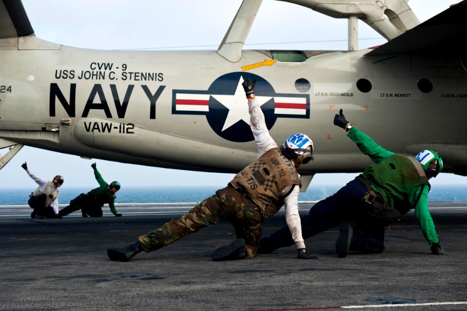 Defense.gov News Photo 110917-N-BT887-389 - Flight deck crew members give the thumbs up to launch an E-2C Hawkeye from the USS John C. Stennis CVN 74 as the aircraft carrier conducts flight