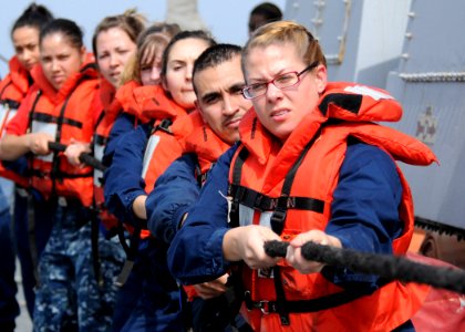 Defense.gov News Photo 120124-N-ZF681-212 - U.S. Navy sailors assigned to the guided-missile destroyer USS Halsey DDG 97 heave a line attached to a lifting band during a man overboard