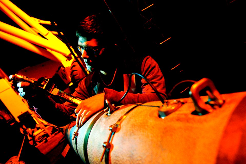 Defense.gov News Photo 120127-N-MD252-588 - U.S. Navy Seaman James Lewis inspects ordnance on the flight deck aboard the aircraft carrier USS Carl Vinson CVN 70 in the Arabian Sea on Jan. 27