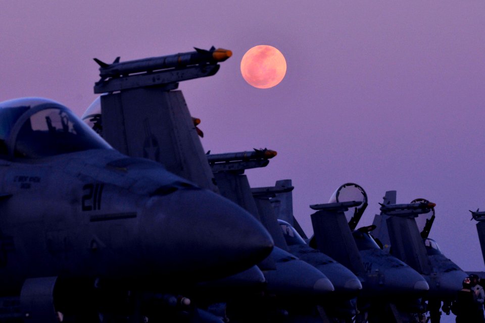 Defense.gov News Photo 120208-N-ZI635-549 - The moon rises over aircraft on the flight deck aboard the aircraft carrier USS Carl Vinson CVN 70 in the Arabian Sea on Feb. 8, 2012