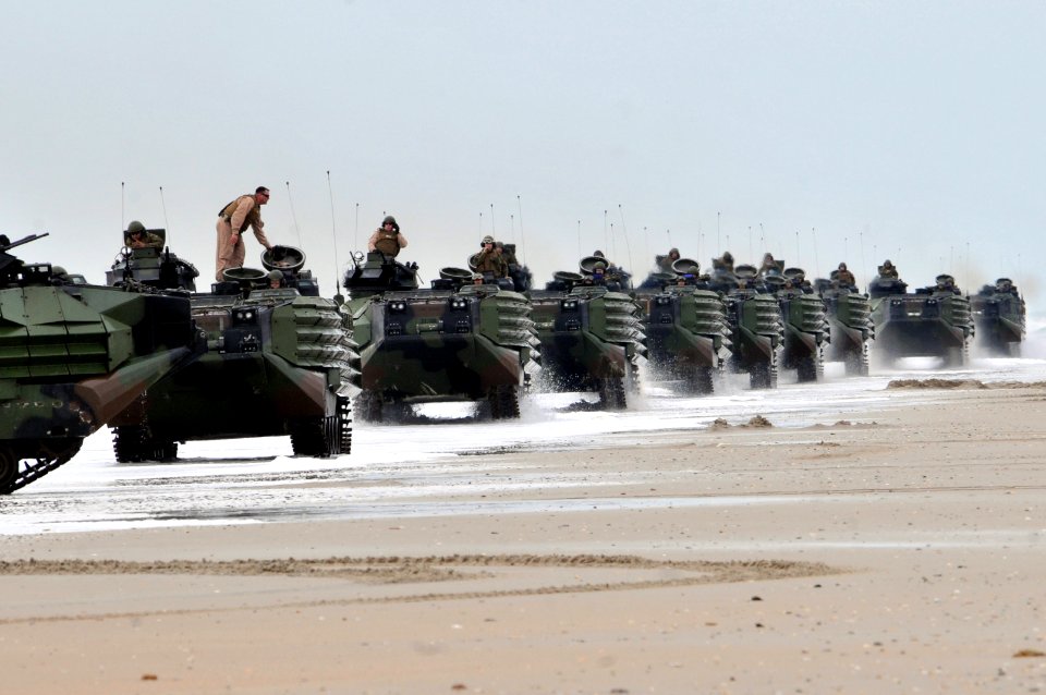 Defense.gov News Photo 120206-N-VG904-065 - U.S. Marine Corps amphibious assault vehicles move into position after reaching the beach during the amphibious assault phase of Bold Alligator