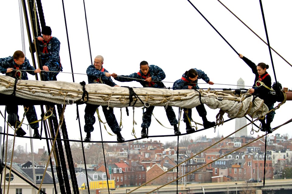 Defense.gov News Photo 120314-N-HN195-769 - Navy sailors place the sail on the yard of the mizzenmast aboard the USS Constitution in Charleston Mass. on March 14 2012. The sailors assigned