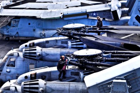 Defense.gov News Photo 120404-N-VE788-036 - U.S. Marines perform maintenance on two CH-53E Sea Stallion helicopters aboard the amphibious assault ship USS Iwo Jima underway in the Atlantic