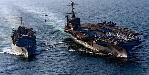 Defense.gov News Photo 120105-N-OY799-347 - The aircraft carrier USS John C. Stennis CVN 74 is underway alongside the Military Sealift Command fast combat support ship USNS Rainier T-AOE 7