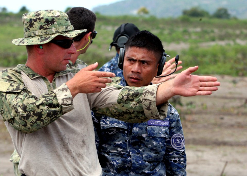 Defense.gov News Photo 120707-N-YU482-006 - U.S. sailors and Filipino service members discuss firing stance techniques during Cooperation Afloat Readiness and Training 2012 in General Santos