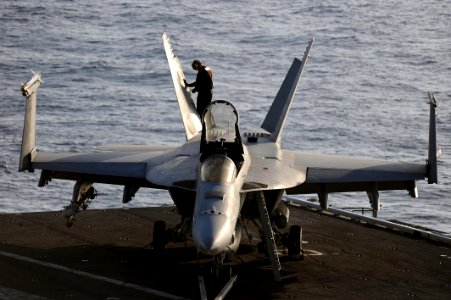 Defense.gov News Photo 120328-N-RY232-127 - A U.S. Navy sailor aboard the aircraft carrier USS Dwight D. Eisenhower CVN 69 performs a post-flight check on an F A-18E Super Hornet from Strike