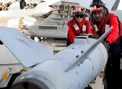 Defense.gov News Photo 120216-N-KQ416-342 - U.S. Navy aviation ordnancemen move ordnance on the flight deck of the aircraft carrier USS Abraham Lincoln CVN 72 while in the Arabian Sea on Feb