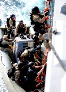 Defense.gov News Photo 120225-N-ZF681-889 - Sailors climb a ladder during visit board search and seizure team training aboard the guided-missile destroyer USS Halsey DDG 97 in the Gulf of photo