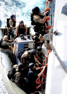 Defense.gov News Photo 120225-N-ZF681-889 - Sailors climb a ladder during visit board search and seizure team training aboard the guided-missile destroyer USS Halsey DDG 97 in the Gulf of