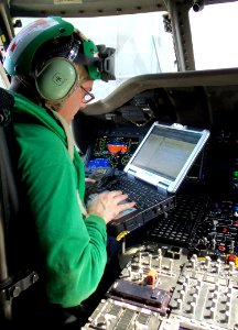 Defense.gov News Photo 120310-N-BL924-002 - Petty Officer 1st Class Charles Cisneros performs diagnostic checks on the mission systems of an MH-60R Sea Hawk helicopter assigned to Helicopter