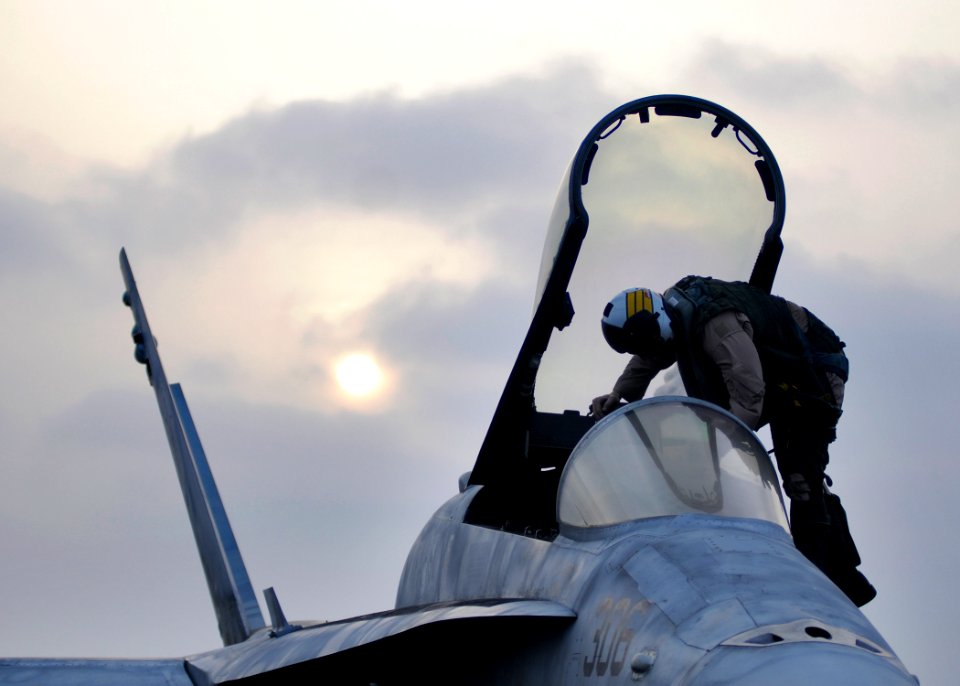 Defense.gov News Photo 120709-N-WD757-401 - A U.S. Navy pilot exits an F A-18C Hornet aircraft after landing aboard the aircraft carrier USS Abraham Lincoln in the Arabian Sea on July 9 2012